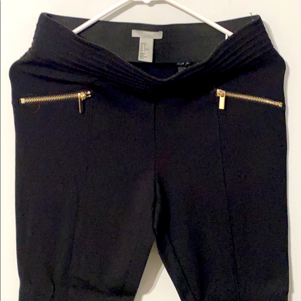 H&M black pants with gold zippers.